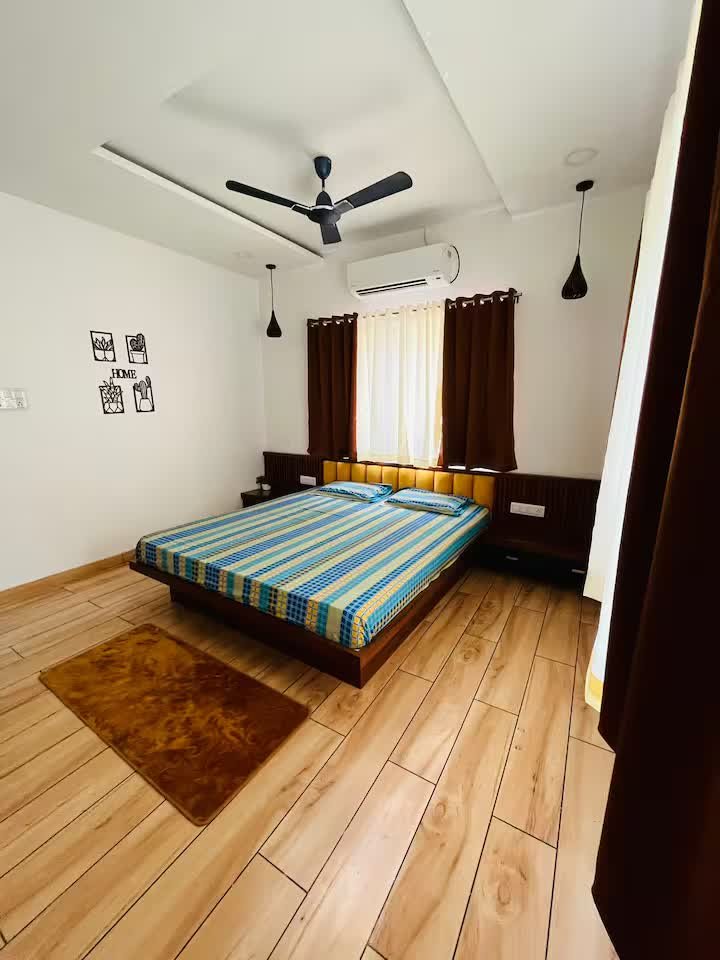 Ground floor room with a king size bed, AC and attached walk-in closet and washroom